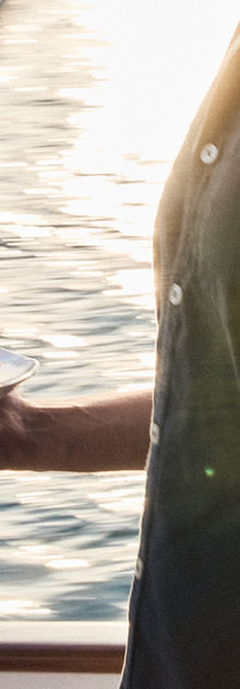 SAILL Group founder/director Jack Barripp serves seared scallops to guests