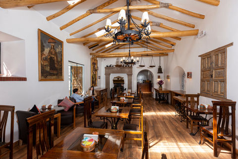 Guests enjoying breakfast with local ingredients and warm atmosphere at Rumi Punku Hotel