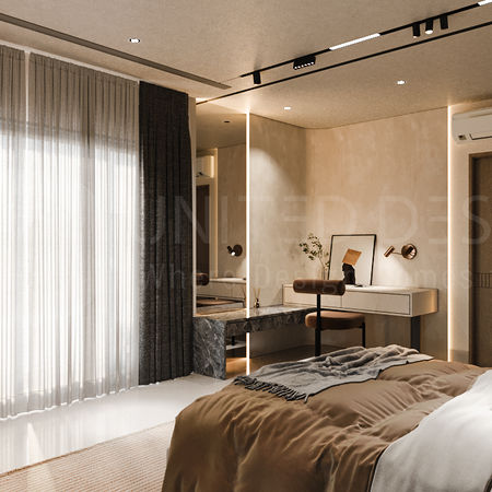Elegant modern bedroom interior with a cozy double bed layered in neutral bedding and throws. Floor-to-ceiling sheer curtains with blackout drapes allow natural light to softly filter into the room. A sleek vanity corner with a marble countertop, floating drawers, and an upholstered chair adds functionality and sophistication, accented by decorative artwork and plants. Warm cove lighting along the wall highlights the textured beige finish, while recessed ceiling spotlights and track lights create a balanced ambiance. A wall-mounted air conditioner ensures comfort, and wooden doors blend seamlessly into the minimalist design. The overall space exudes calm, luxury, and contemporary style.