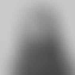 Girl looking at camera in solid background and black and white image