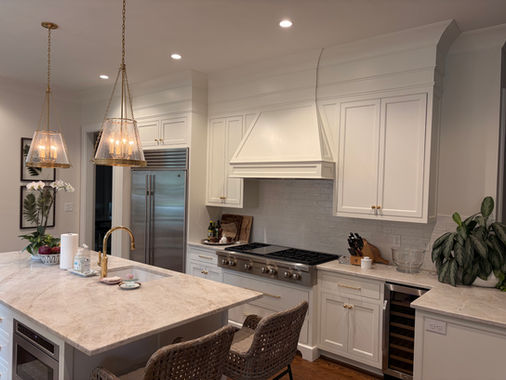 Bright, white kitchen renovation hood vent