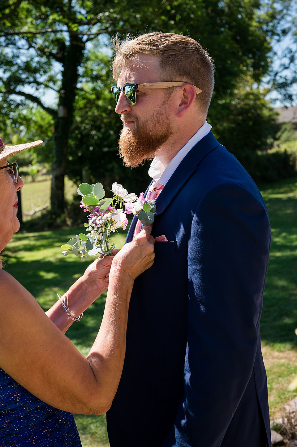 Best mans Buttonhole being put on