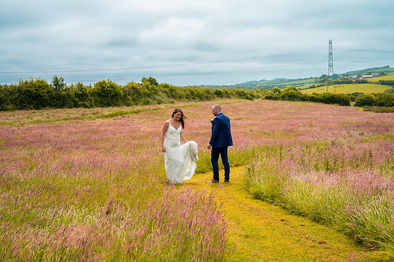 Bride and Groom in the wildflower meadow at Avalen Farm
