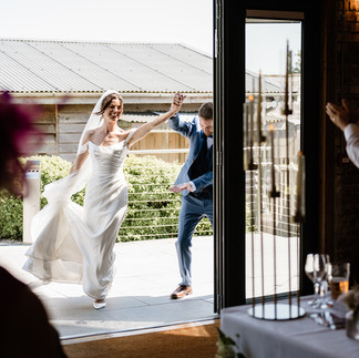 Bride and Groom entering the wedding reception