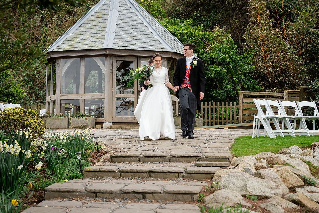 bride and groom leaving ceremony for the confetti throw
