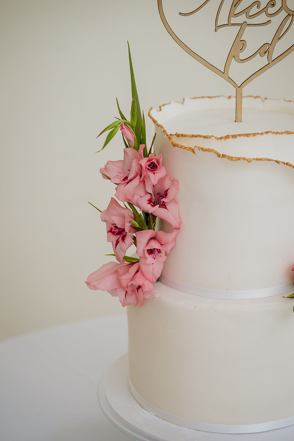Wedding cake with pink fresh flowers