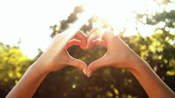 depositphotos_119659338-stock-video-hands-of-woman-forming-heart.jpeg