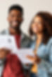 One black man and one woman, mid 20s, wanting to find work and excited about ordering a ne