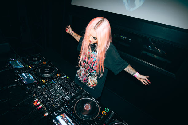 DJ photograph, high energy, flash photography