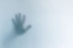 defocused-scary-ghost-hands-behind-a-whi