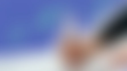 Hand writing on sheet of paper with illustrated doodles around