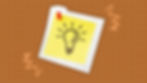 Sticky note tacked up with drawing of light bulb