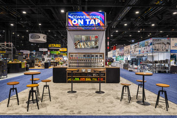 Hybrid custom modular trade show exhibit with backlit graphics and food service industry equipment