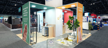 Modular trade show exhibit with integrated lighting and lounge seating area
