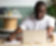 Male College Student Writing and Working on Laptop