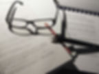 Pair of Glasses over words
