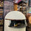 Thumbnail: The Napolitano Oven by Pizza Academy features a unique dual-fuel cylinder design, allowing it to run on both wood and gas. Pe