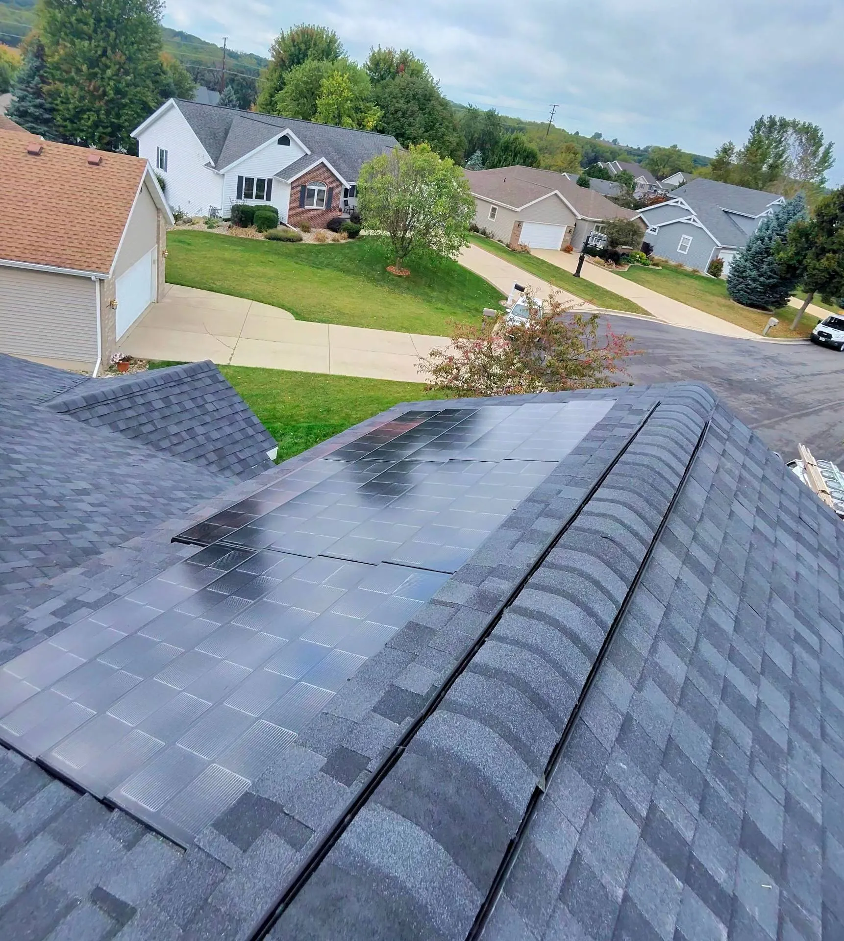 solar shingles installation on residential roof in Madison WI with integrated solar roofing system