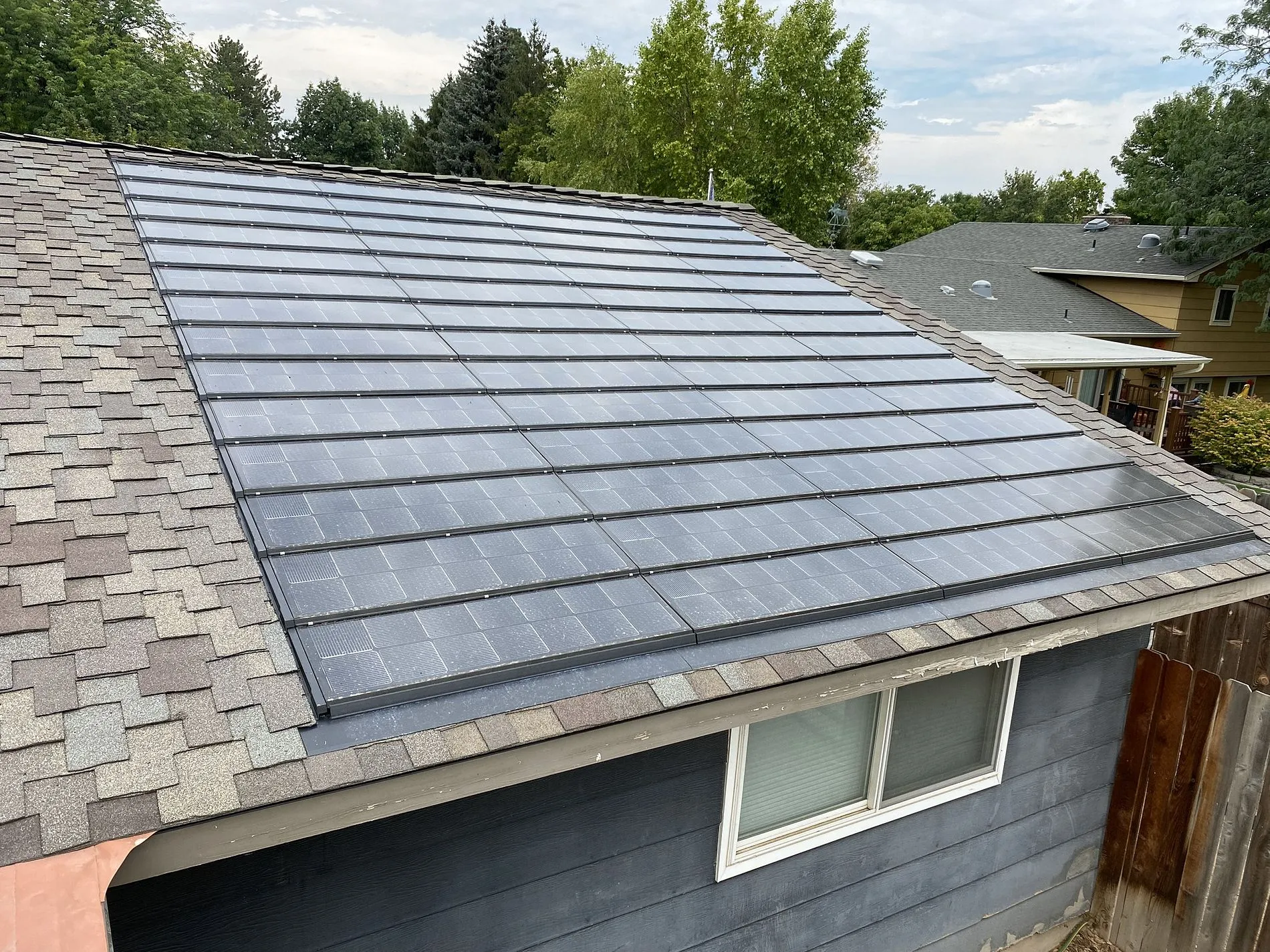 Solstice solar shingles create more contrast with a light gray Presidential TL Shake shingle