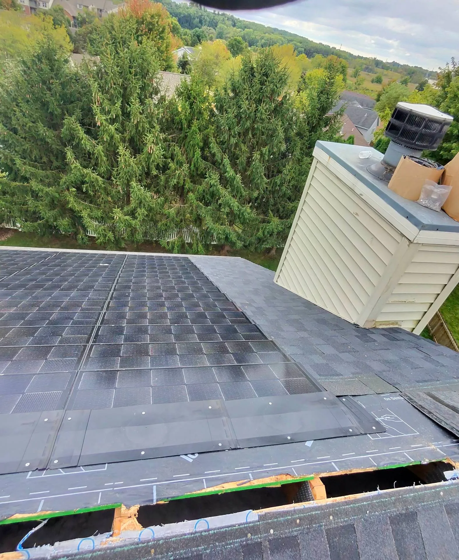Solstise solar shingle installation looking down from roof ridge