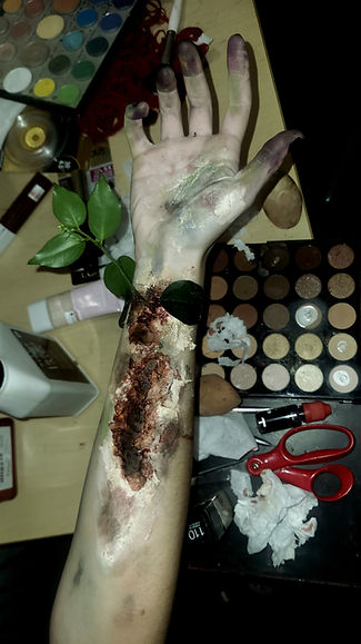 Special Effects makeup of rotting arm with overgrown vines