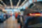 vecteezy_new-cars-stand-in-a-row-in-a-car-showroom-generated-by_47536634.jpg