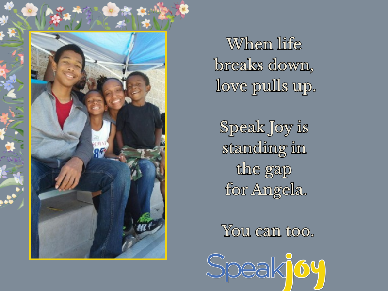 A mom holding her three sons.