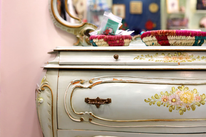 rococco chest of drawers with pink wall