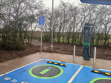 A fully installed EV charging point on a forecourt