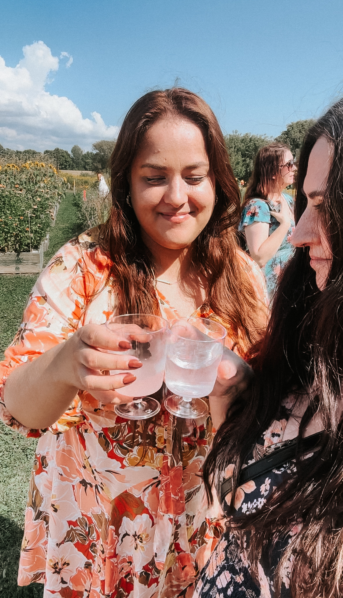 Influencer Tash Cook and J.C. Hannigan toasting to the BAYB Garden Party event.