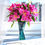 Thumbnail: Luxury art glass vase with a sculptural twisted shape holding bright pink flowers in natural sunlight