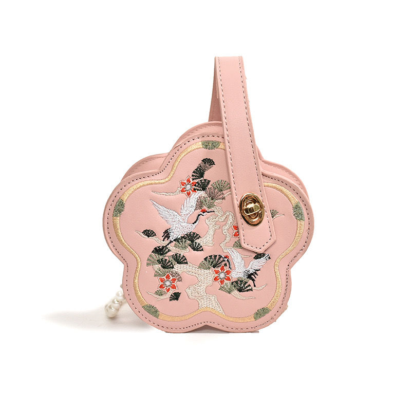 Thumbnail: Vintage-Inspired Embroidered Crossbody Bag This charming vintage-inspired bag