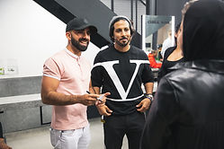 2 men talking to another woman during the CHALK opening
