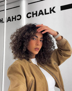 Woman with short, bouncy natural curls