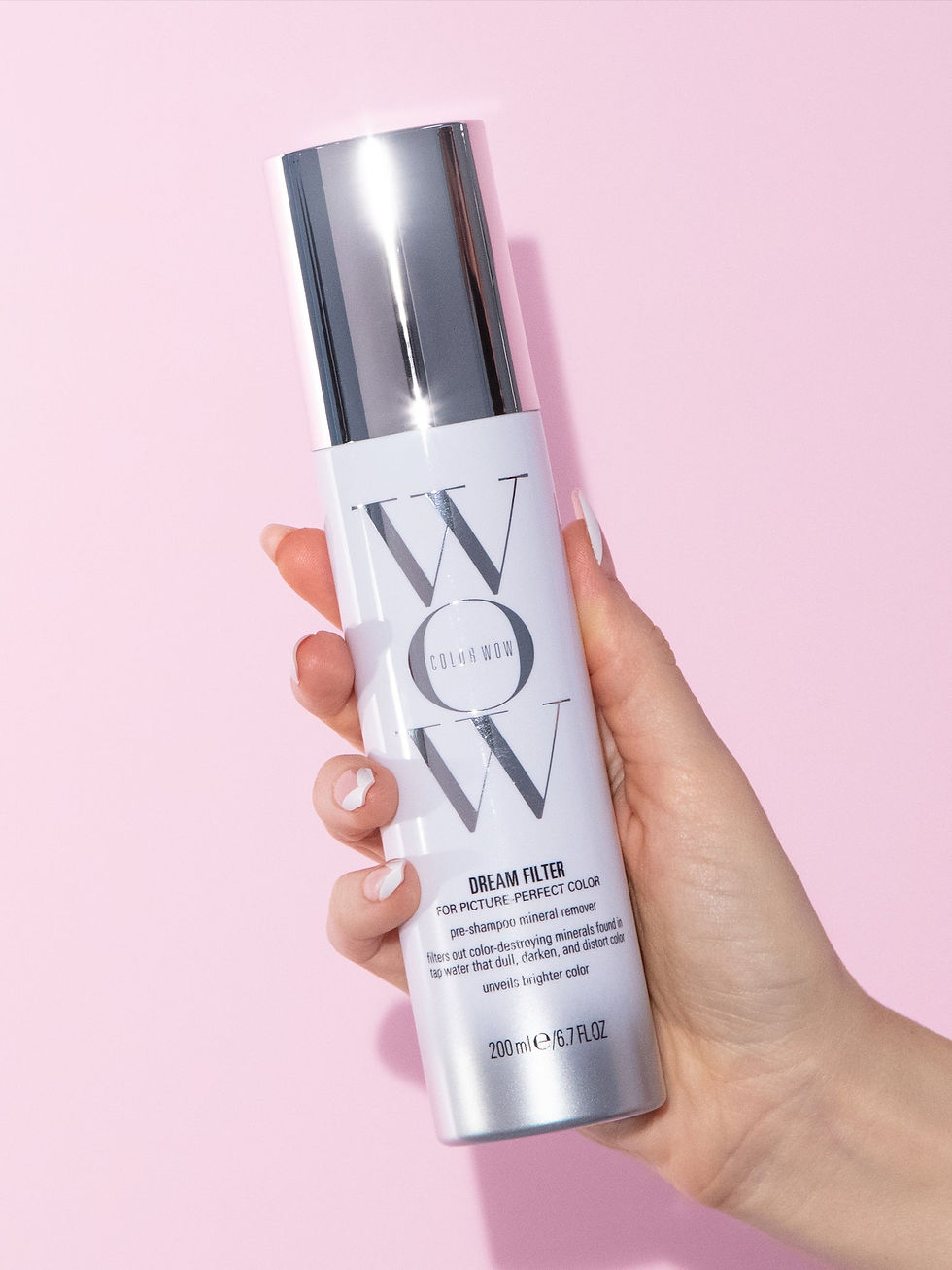 Thumbnail: Color WOW Dream Filter For Picture-Perfect Color front view with a hand holding it slightly tilted