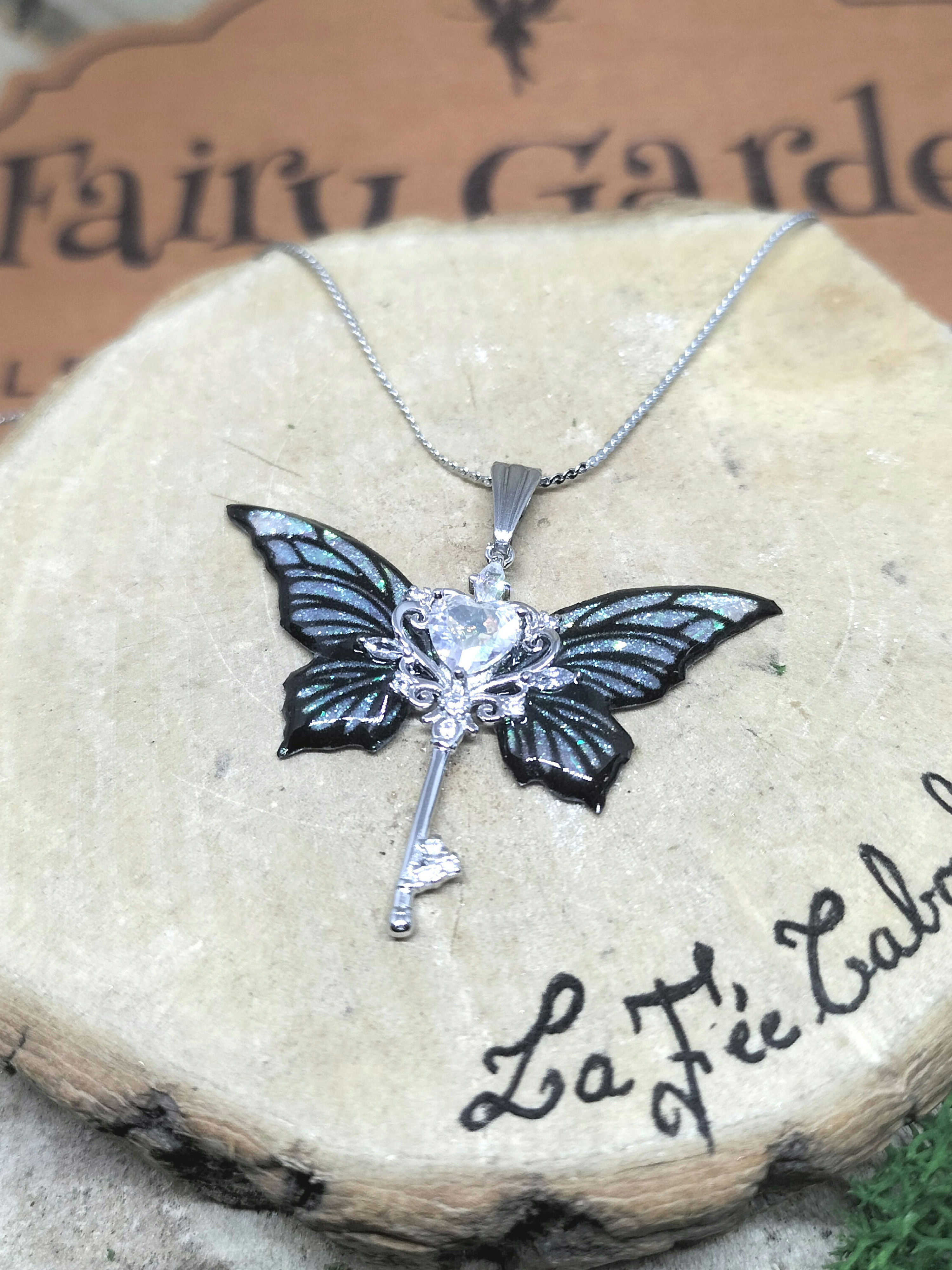 Collier clé féerique acier 