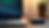 Close-up view of a laptop charger on a desk