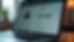 Close-up of a laptop listing on an online marketplace with detailed specs