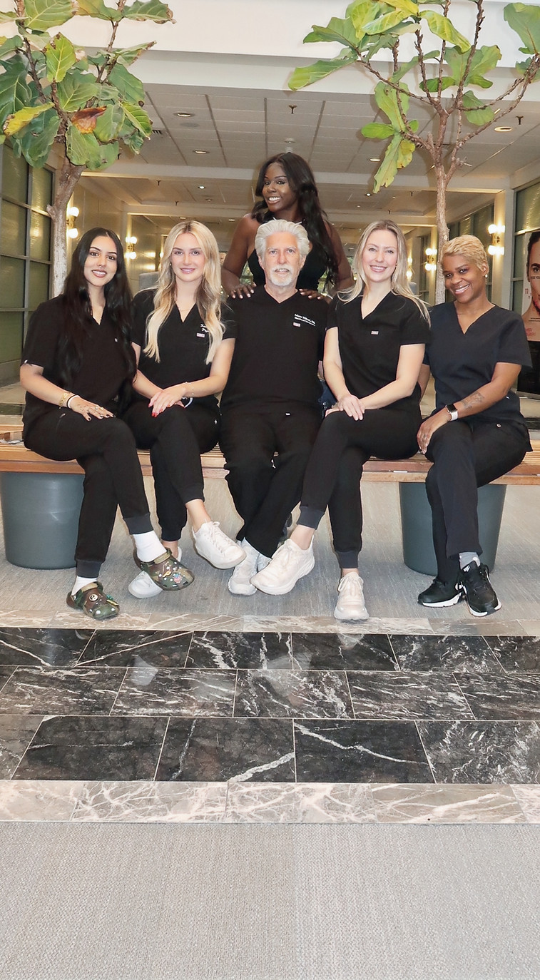 Professional med spa staff team at Bala Better Health posing for a group photo