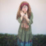Trelawney, a Harry Potter themed birthday character in full costume, looks into the camera posing dramatically. 