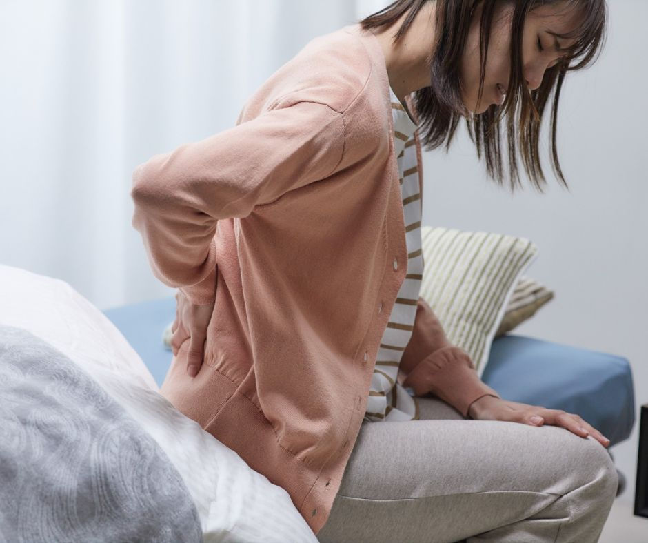 Woman holding low back.jpg