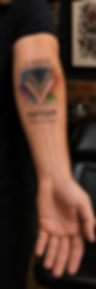 Arm featuring the Laser Tattoff logo tattoo, representing professional laser tattoo removal and advanced skin treatments.