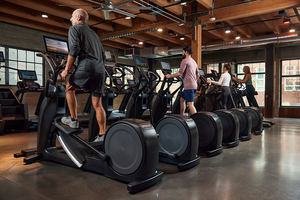 Precor_Facility_Row_of_EFX_with_People_plus_other_Precor_Cardio_with_P94_P84_consoles.png