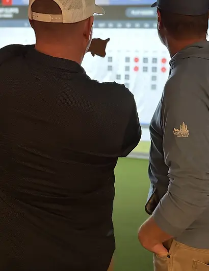 Men 50+ Silver Fox golf league at Mulligans Indoor Golf competing on simulator.