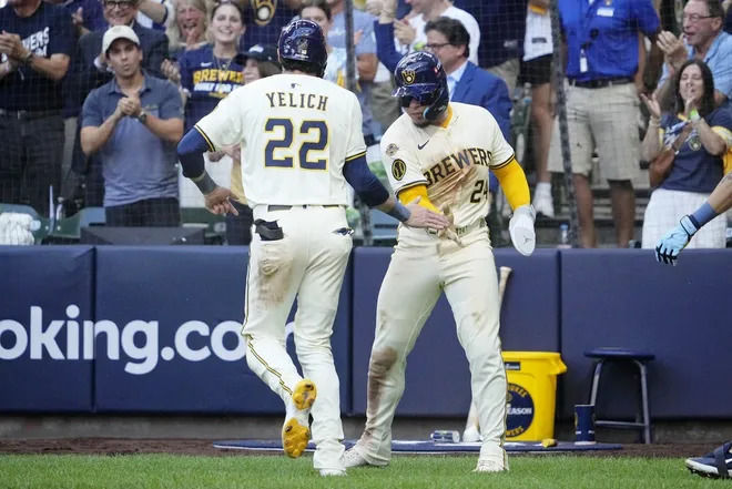 Photo Caption: Christian Yelich being greeted by William Contreras after scoring a run against the Chicago Cubs in Game 2 of the NLDS on October 6, 2025. Photo Credit: Data Skrive/Sportsbook Wire.