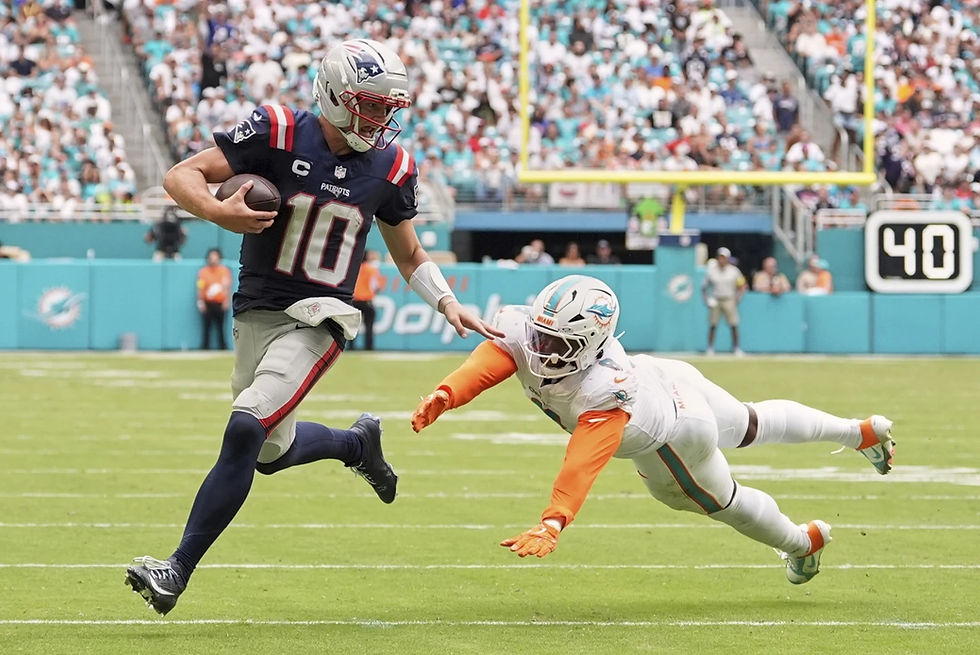 Photo Caption: Patriots quarterback Drake Maye evading Dolphins linebacker Matthew Judon for a touchdown during New England’s 33-27 victory over Miami on September 14, 2025. Photo Credit: Rebecca Blackwell/AP Photo.