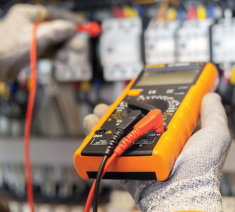image of electrician testing with ohmmeter