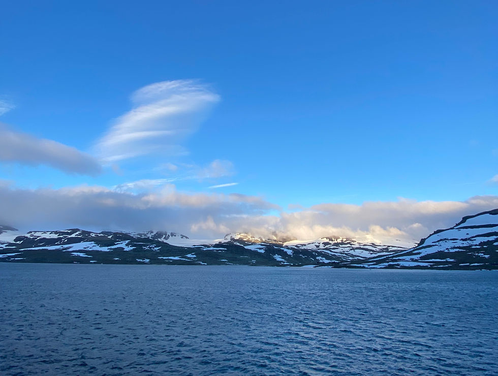 Early Summer views from Finse village over the lake towards the glacier.