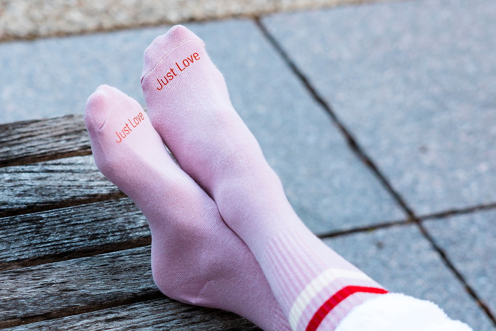 Thumbnail: Pink "Just Love" socks from Mantra-Head on a person