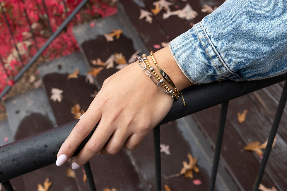 Thumbnail: Stack the "Be Calm" engraved mantra beaded bracelet in Gold along with a two-tone beaded bracelet and a Silver paperclip one